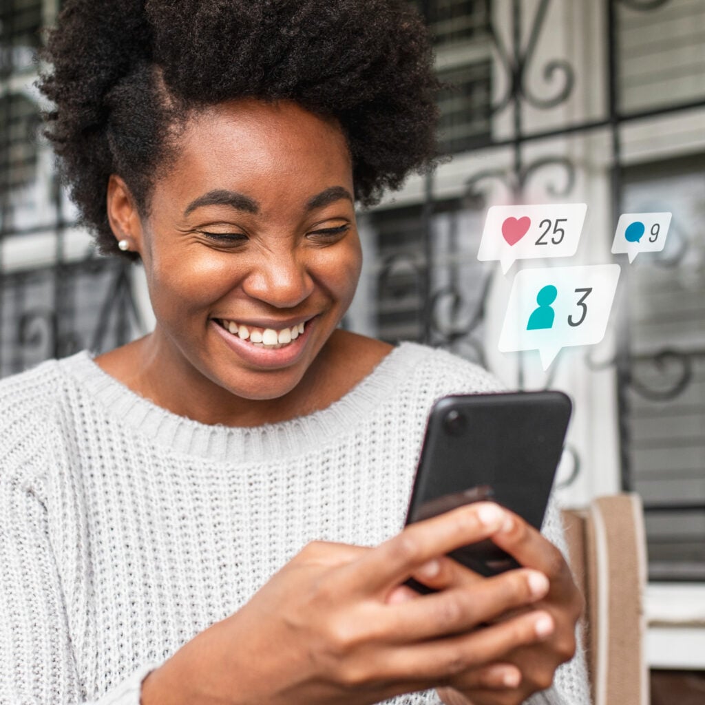 lady smiling at digital engagement on her phone